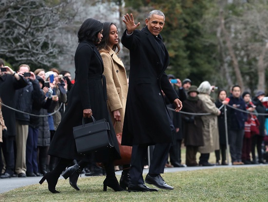 Barack and Michelle Obama with Givenchy Bag outside of Washington D.C. and their daughter