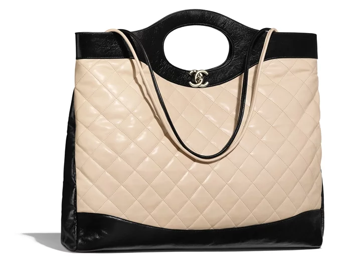 chanel-31-large-shopping-bag-beige-black-aged-calfskin-calfskin-gold-tone-metal-packshot-default-a57978y84012c1633-8807097171998